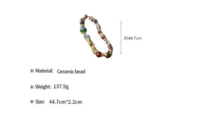 Handcrafted Ceramic Bead Necklace – Artistic Gold Twist Statement