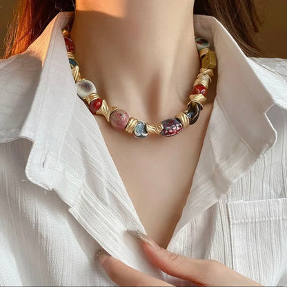 Handcrafted Ceramic Bead Necklace – Artistic Gold Twist Statement